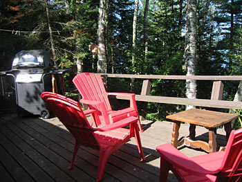 deck with adirondack chairs